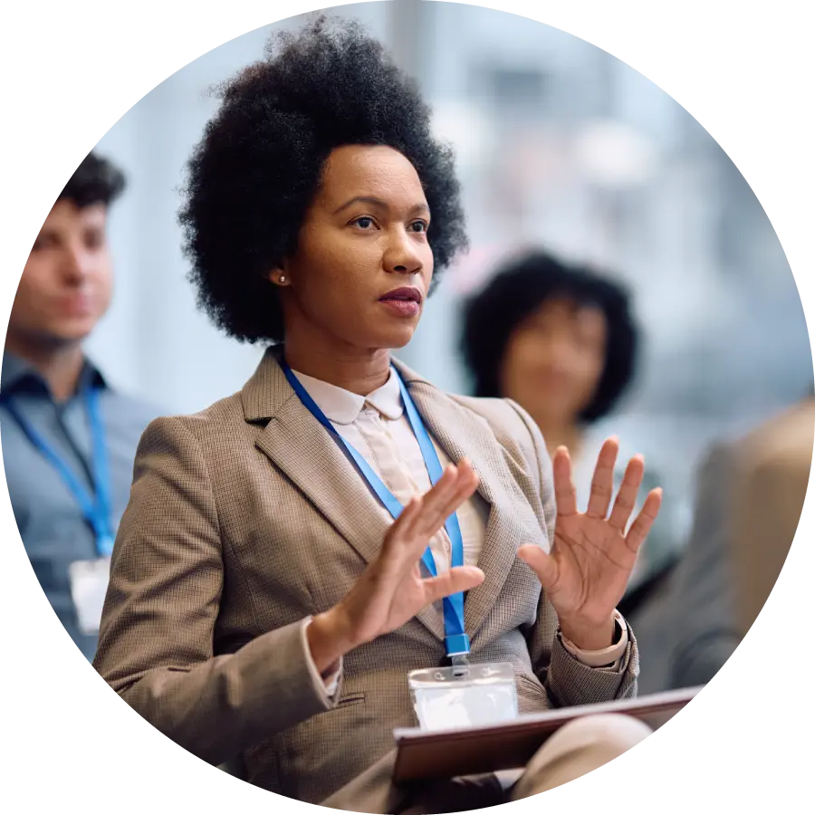 Black businesswoman participating in an education event at conference hall